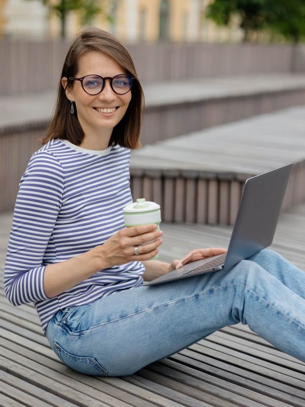 marketing-or-design-professional-working-and-drinking-coffee-outdoors.jpg